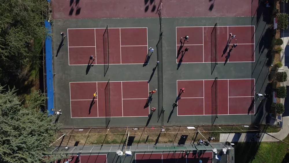 Drone view of the courts, vendor tents and sponsor banners at Perris Hill Park