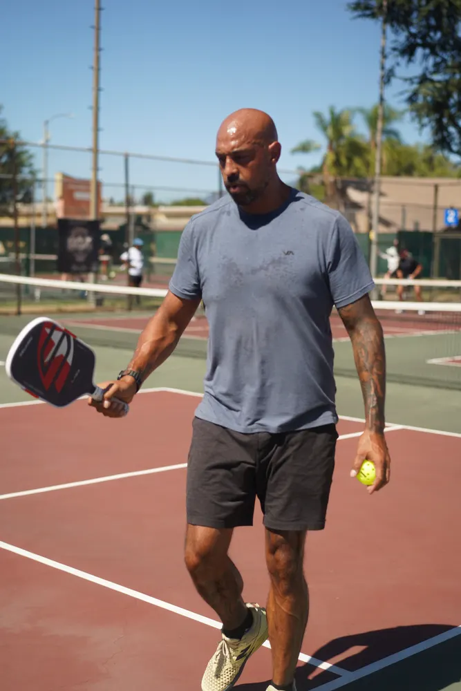 Player at the ready position waiting on the serve