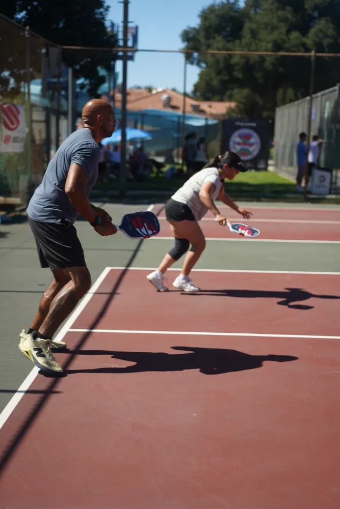 Doubles players covering the court during a point